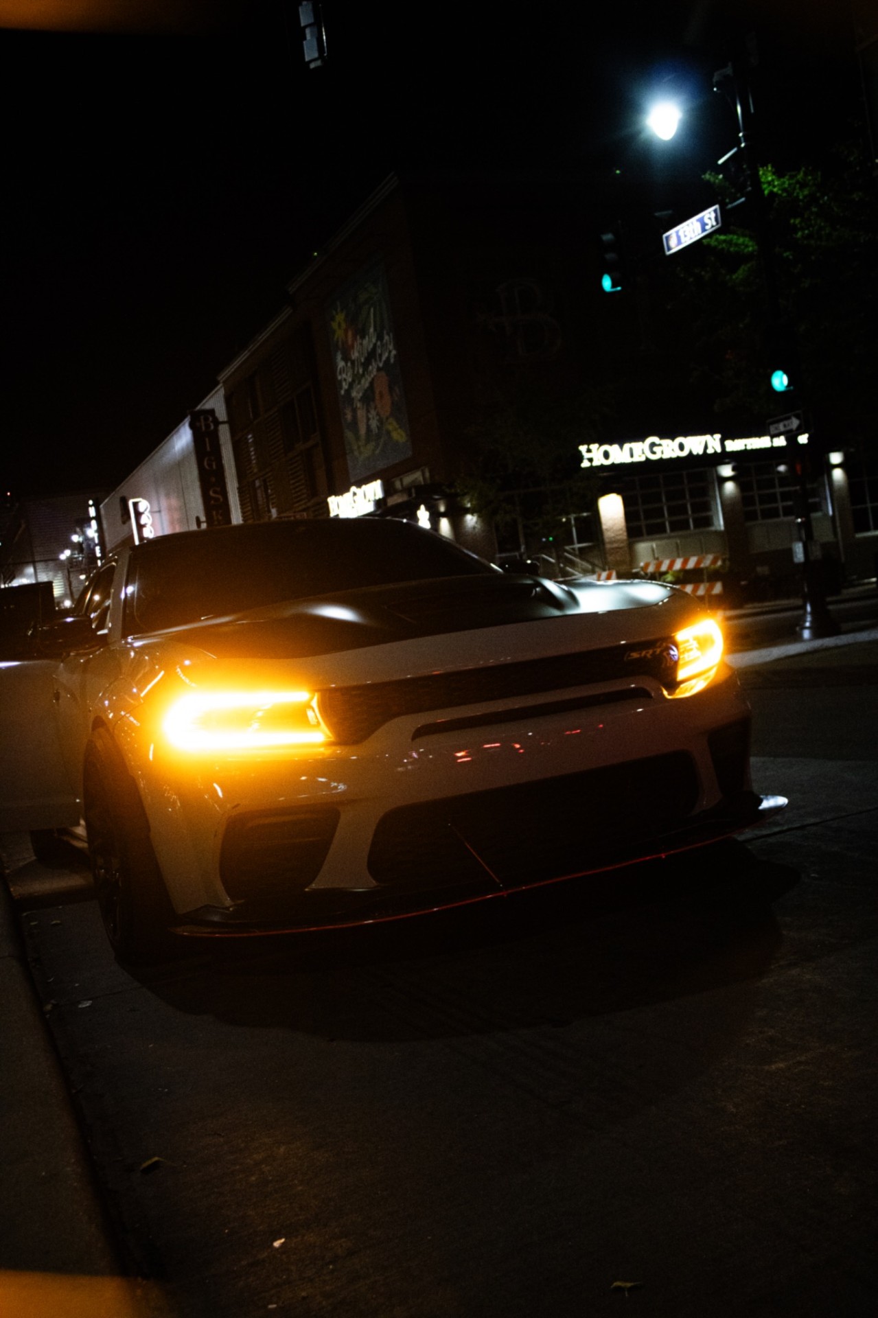 SRT Charger at night under city street lights